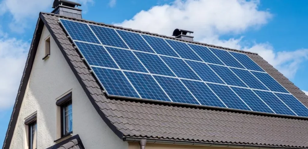 Home in Hermosa Beach, California with newly installed rooftop solar panels on a sunny day