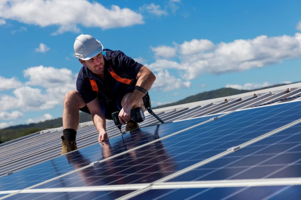Luxury home in Malibu, CA with rooftop solar panel installation and ocean view